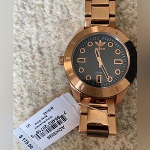 Adidas watch.never worn. needs battery. unisex style.